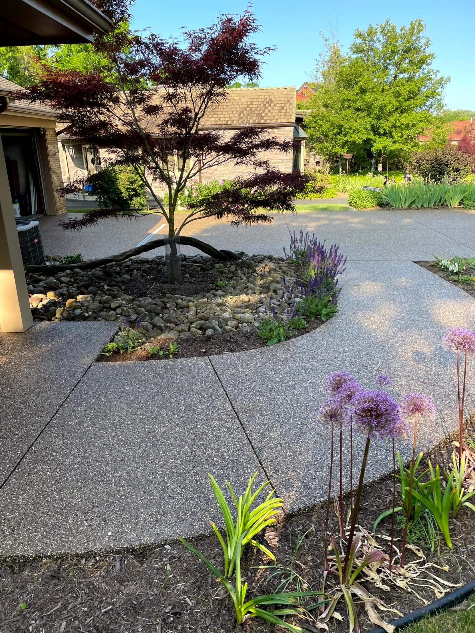 Exposed Concrete Driveway and Curved Walkway